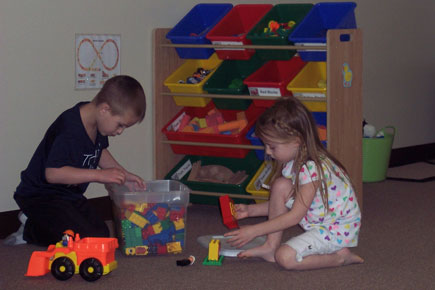 Miss Cassie helping a student
